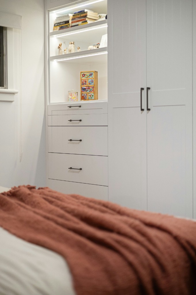 White shaker wardrobe with lit open shelving